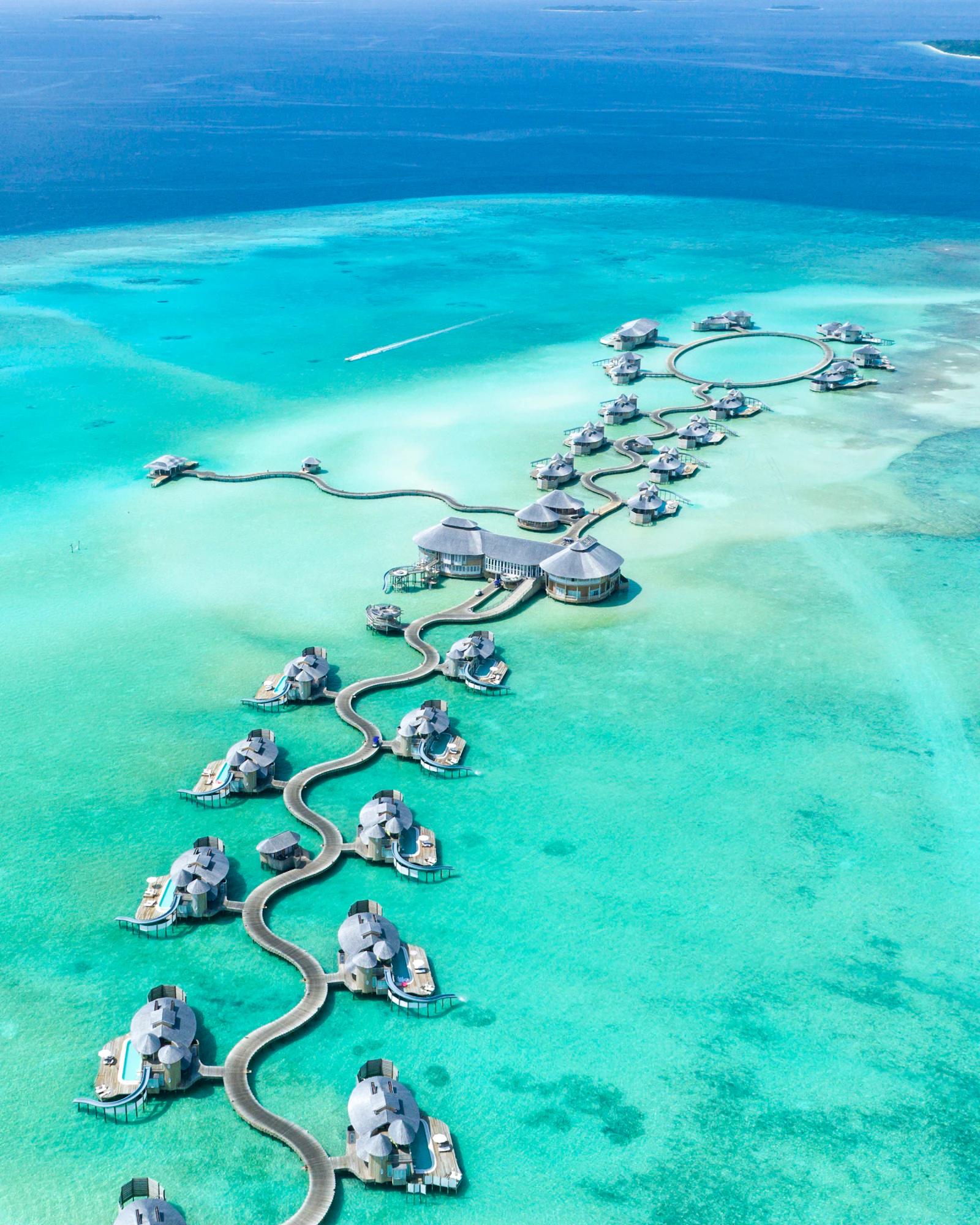 Overwater retreat surrounded by clear blue water
